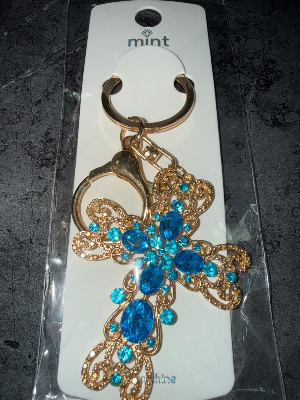 Mint Gold-Tone Cross Keychain with Bright Blue Gems